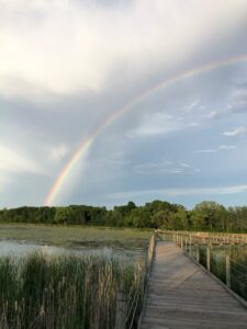 A rainbow over the Lake Camelot boardwalk