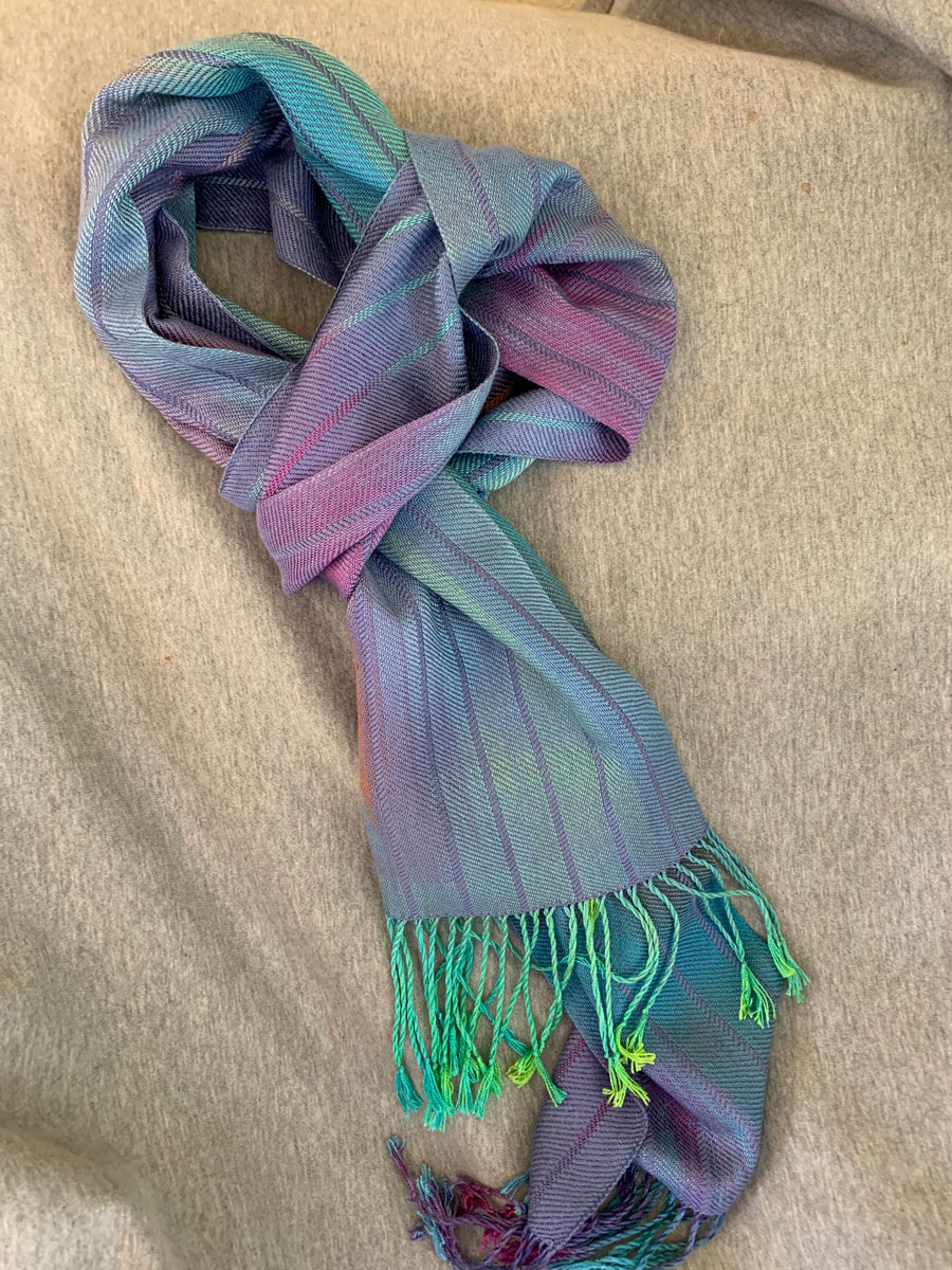 Colorful green, blue, and purple woven wrap